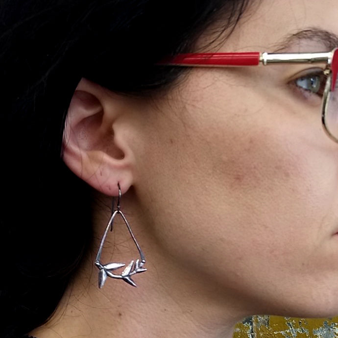Silver cast Branch earrings with angle wires by Alice Scott on model ear