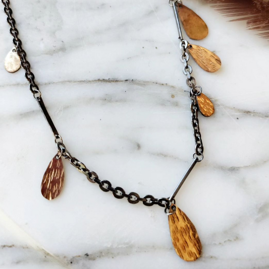 gold fill hammered drops on blackened silver chain with marble background by Alice Scott