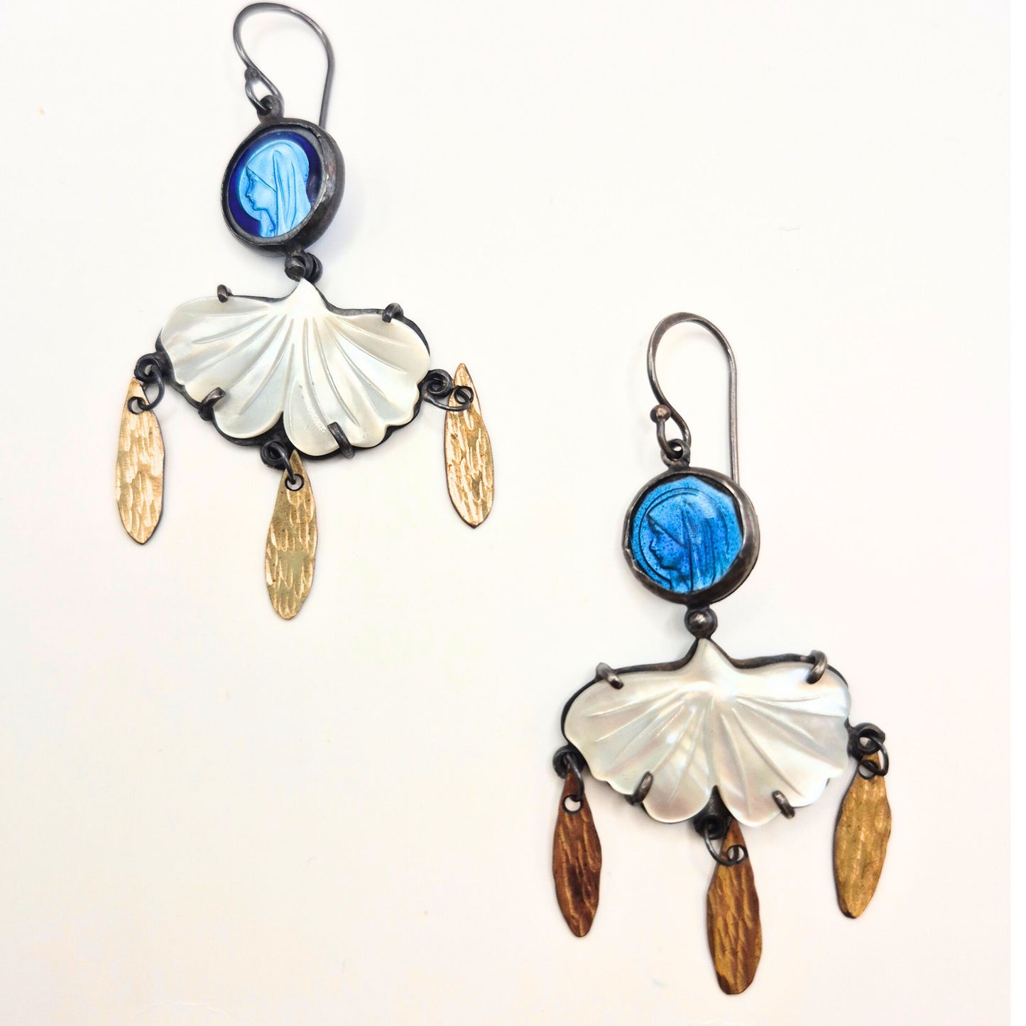 Pair of earrings with shell and vintage rosaries on a white background by Alice Scott